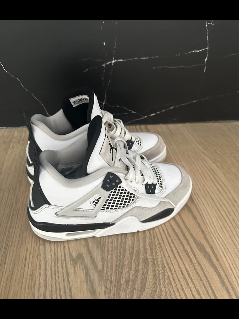 Kids Jordan 4 White and Black Athletic Sneakers Size 5.5